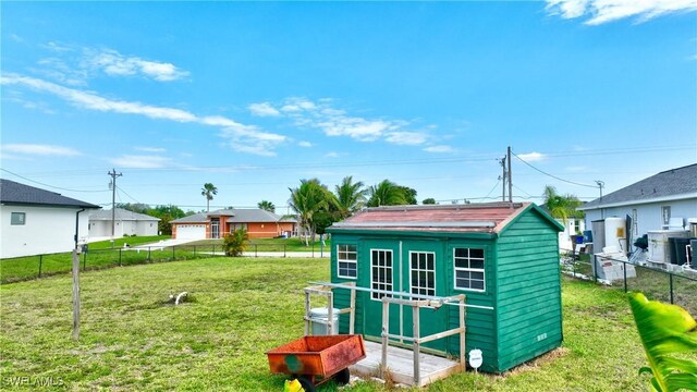 view of shed with fence