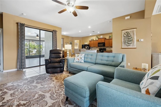 living room with visible vents, a ceiling fan, recessed lighting, light tile patterned flooring, and baseboards