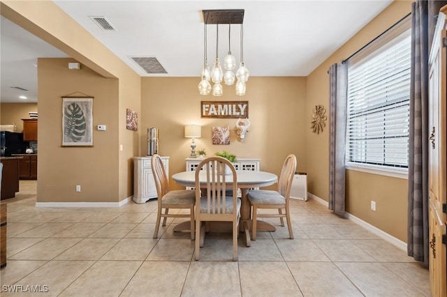 dining space with visible vents, baseboards, and light tile patterned flooring