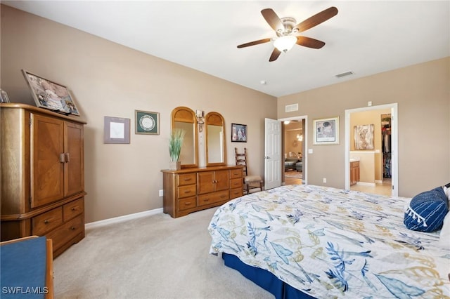 bedroom featuring visible vents, light colored carpet, baseboards, and ceiling fan