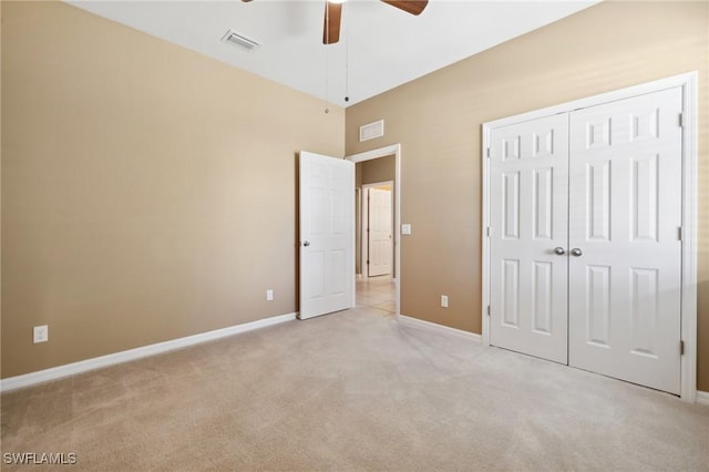 unfurnished bedroom featuring visible vents, baseboards, and light colored carpet