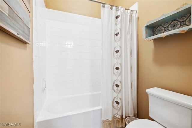 bathroom with toilet and shower / tub combo with curtain