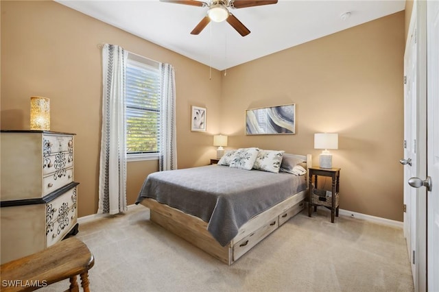 bedroom with baseboards, carpet, and a ceiling fan