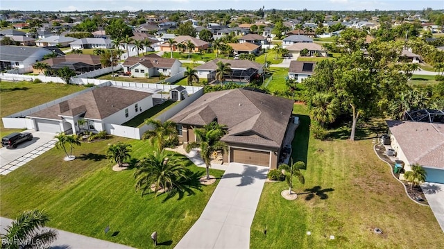 birds eye view of property with a residential view