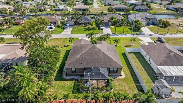 bird's eye view with a residential view and a water view