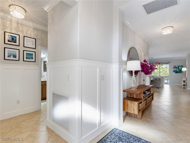 21116 Bella Terra Blvd, Estero, FL 33928 - hall with light tile patterned floors, visible vents, and crown molding