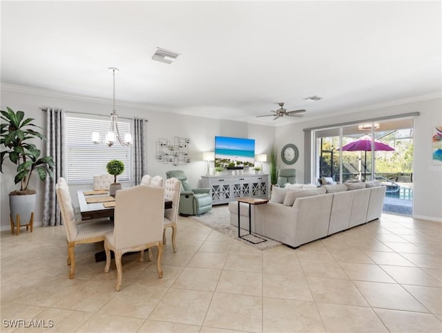 21116 Bella Terra Blvd, Estero, FL 33928 - dining area featuring light tile patterned floors, visible vents, ceiling fan with notable chandelier, and crown molding