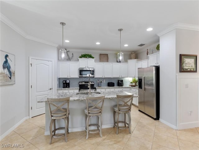 21116 Bella Terra Blvd, Estero, FL 33928 - kitchen featuring ornamental molding, stainless steel appliances, light tile patterned flooring, white cabinets, and decorative backsplash