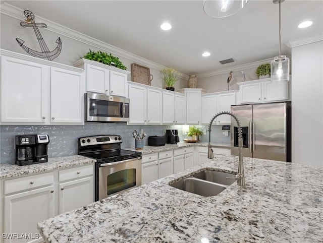 21116 Bella Terra Blvd, Estero, FL 33928 - kitchen featuring a sink, crown molding, white cabinetry, and stainless steel appliances