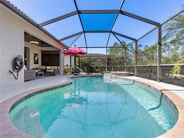 21116 Bella Terra Blvd, Estero, FL 33928 - view of swimming pool featuring an outdoor living space, glass enclosure, a patio, and a pool with connected hot tub