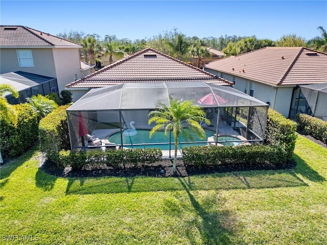 21116 Bella Terra Blvd, Estero, FL 33928 - exterior space featuring a lanai and a lawn