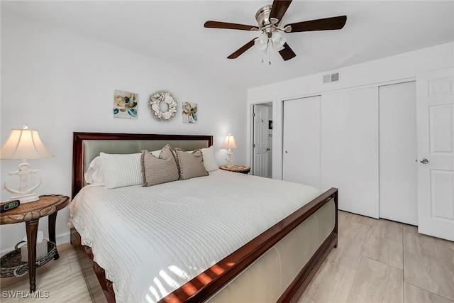 bedroom with visible vents, a closet, ceiling fan, and light wood finished floors