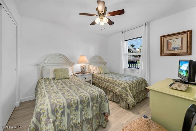 bedroom featuring light wood-style floors and ceiling fan