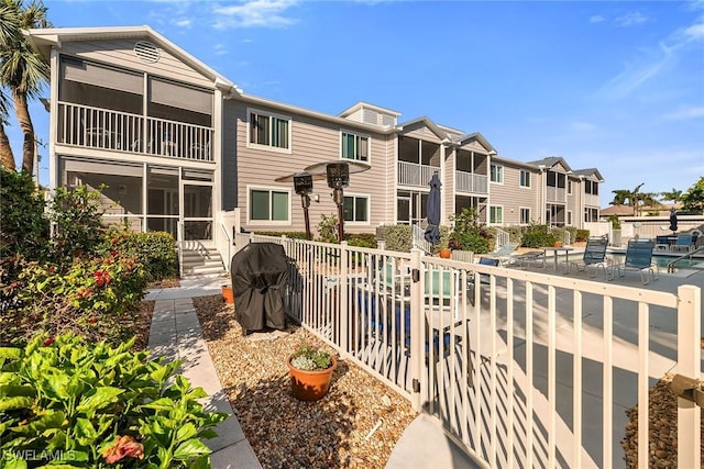 exterior space with a residential view and area for grilling