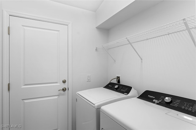 laundry room featuring washer and dryer and laundry area