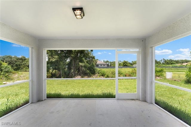 unfurnished sunroom with plenty of natural light