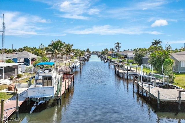 dock area featuring a residential view, a water view, and boat lift