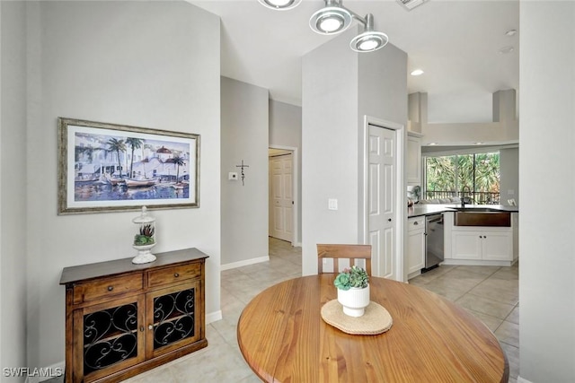 dining room featuring light tile patterned floors, visible vents, and baseboards