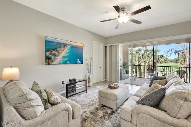 living room with tile patterned flooring and ceiling fan