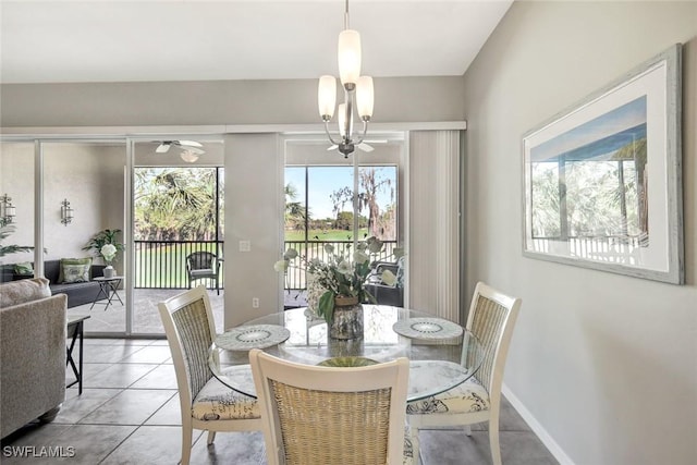 dining space with light tile patterned flooring and baseboards