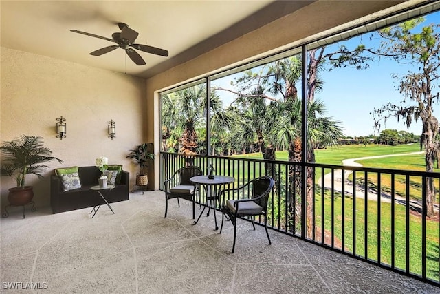 sunroom with a ceiling fan