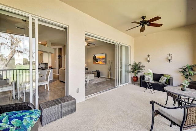 view of patio with ceiling fan and outdoor lounge area