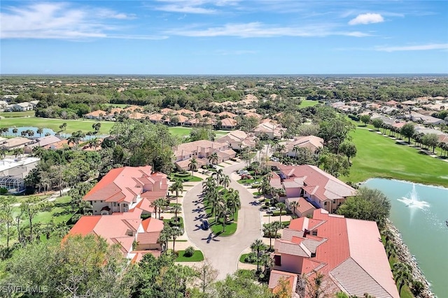 aerial view featuring a residential view, a water view, and view of golf course