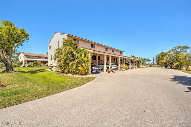 13508 Siesta Pines Ct Unit 7, Fort Myers, FL 33908 - view of property featuring covered parking