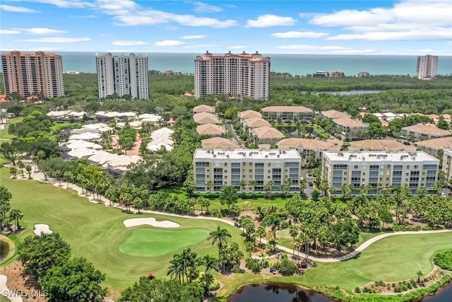 birds eye view of property with a water view, a city view, and golf course view