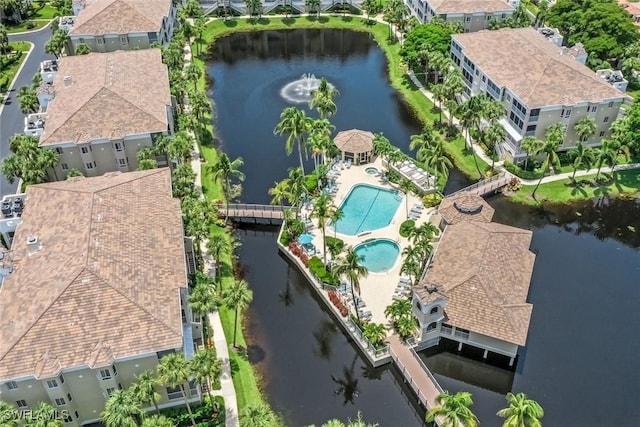 bird's eye view featuring a water view and a residential view