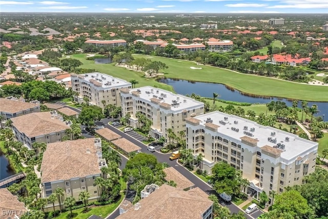 bird's eye view featuring golf course view and a water view