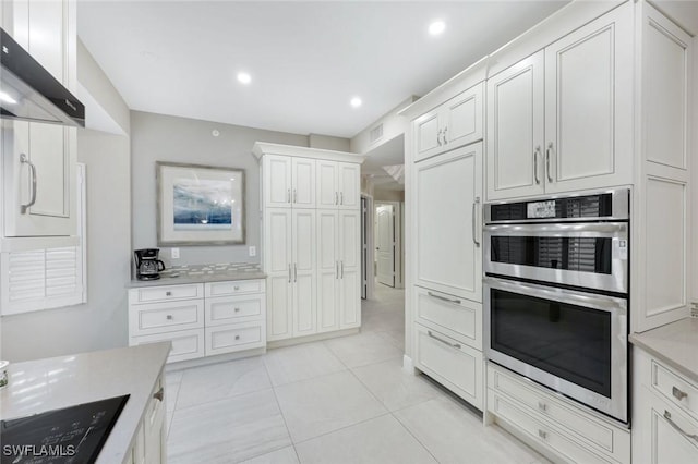 kitchen with range hood, white cabinetry, recessed lighting, double oven, and light countertops