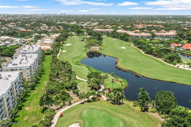 aerial view with golf course view and a water view