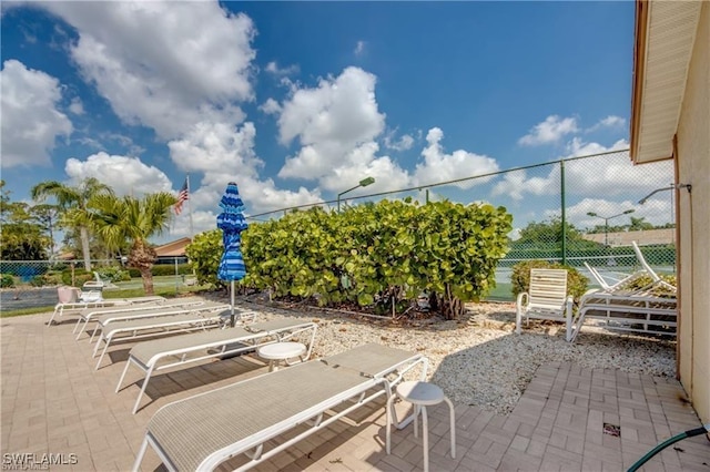 view of patio featuring fence