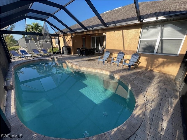 pool featuring a lanai and a patio