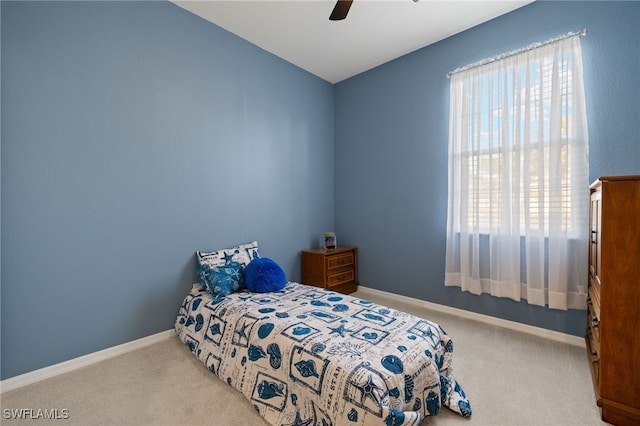 bedroom with baseboards, a ceiling fan, and carpet flooring