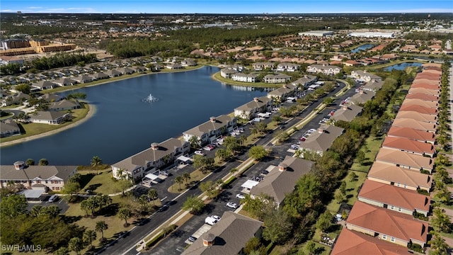 bird's eye view featuring a residential view and a water view