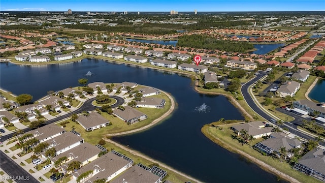 birds eye view of property featuring a water view and a residential view