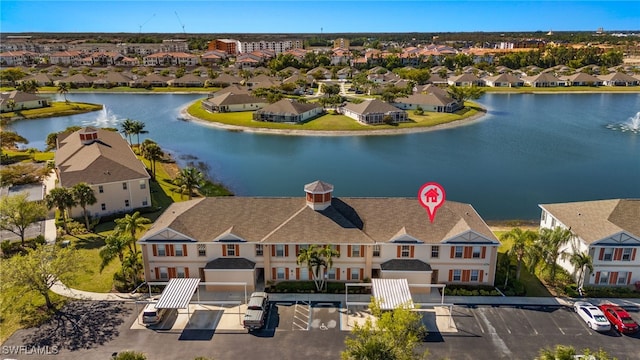 aerial view featuring a residential view and a water view