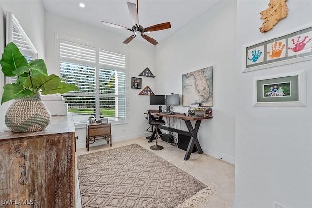 office space featuring baseboards and a ceiling fan