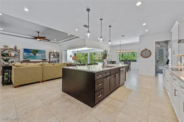 kitchen featuring a sink, dishwasher, a ceiling fan, and white cabinetry