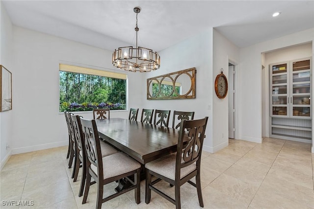 dining area with light tile patterned floors, baseboards, a chandelier, and recessed lighting