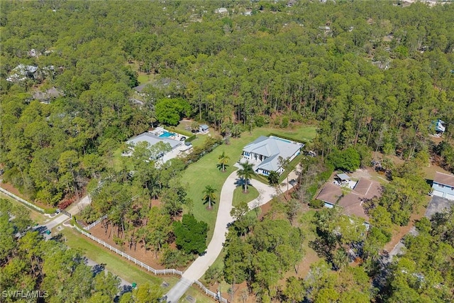 drone / aerial view with a view of trees