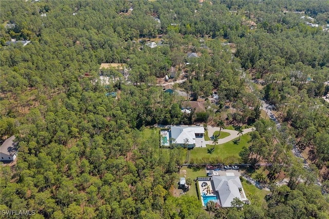 aerial view with a wooded view