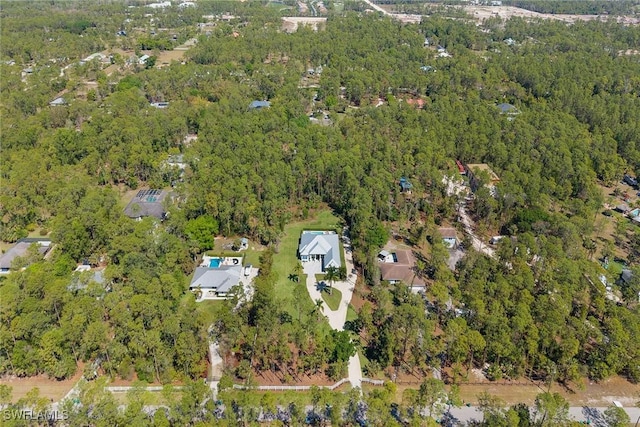 aerial view with a wooded view