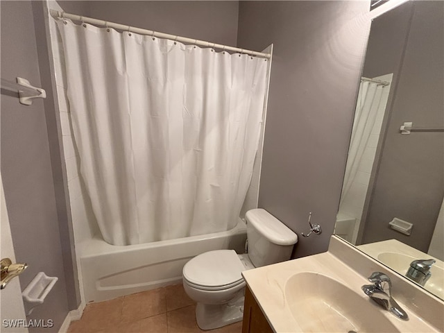 bathroom featuring vanity, toilet, shower / tub combo with curtain, and tile patterned flooring