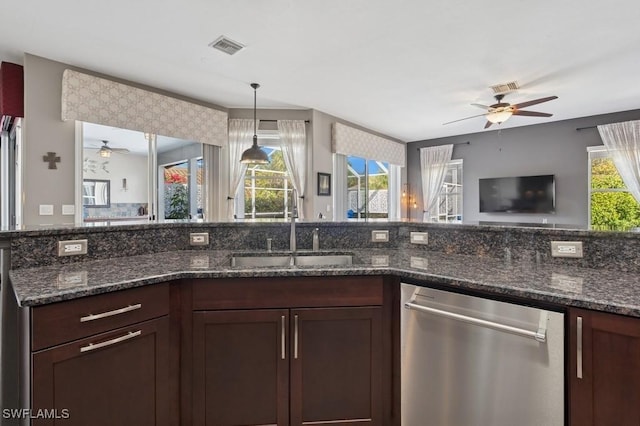 kitchen with a sink, dishwasher, a wealth of natural light, and a ceiling fan