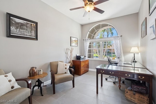 office area with tile patterned flooring, baseboards, and a ceiling fan