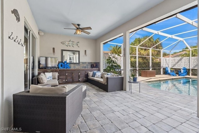 exterior space with a ceiling fan, glass enclosure, a fenced in pool, an outdoor hangout area, and a hot tub