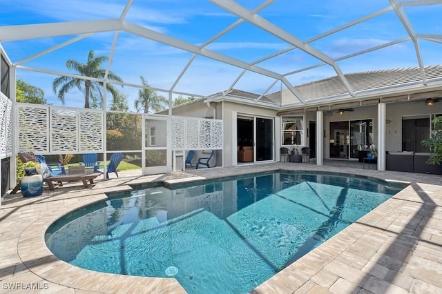 pool featuring a patio area, outdoor lounge area, and a ceiling fan